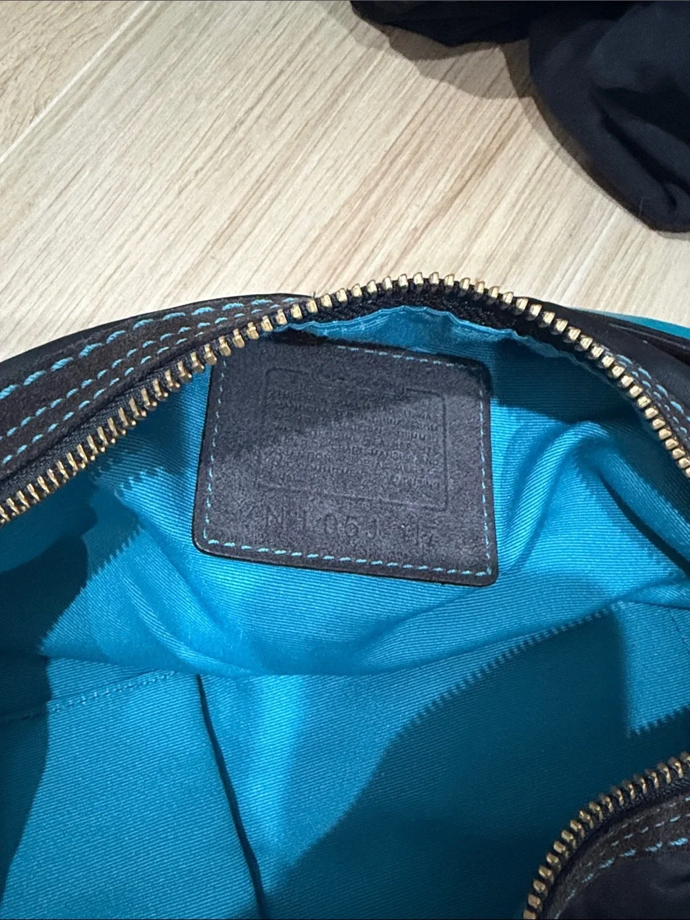 Coach Black Hobo Bag with Turquoise Tag Accent